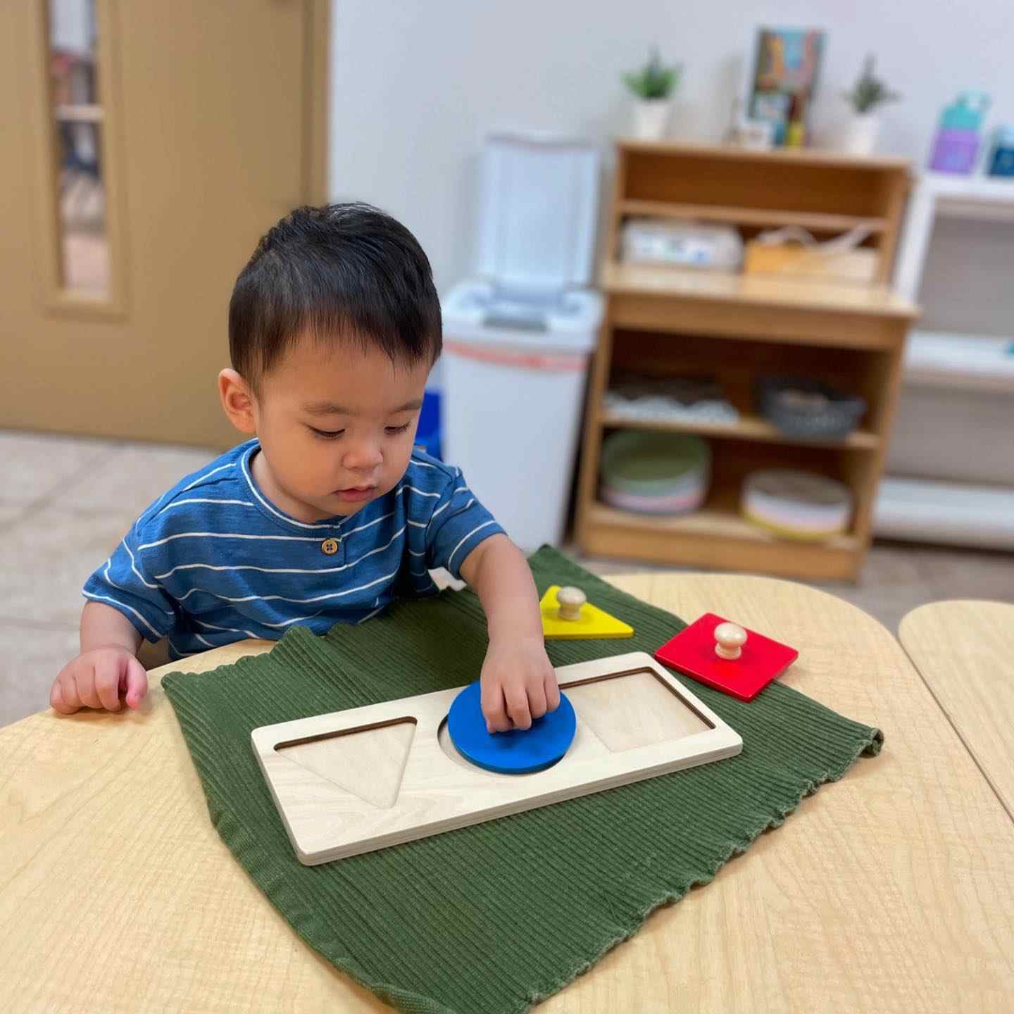 Walking infants working on fine motor activities